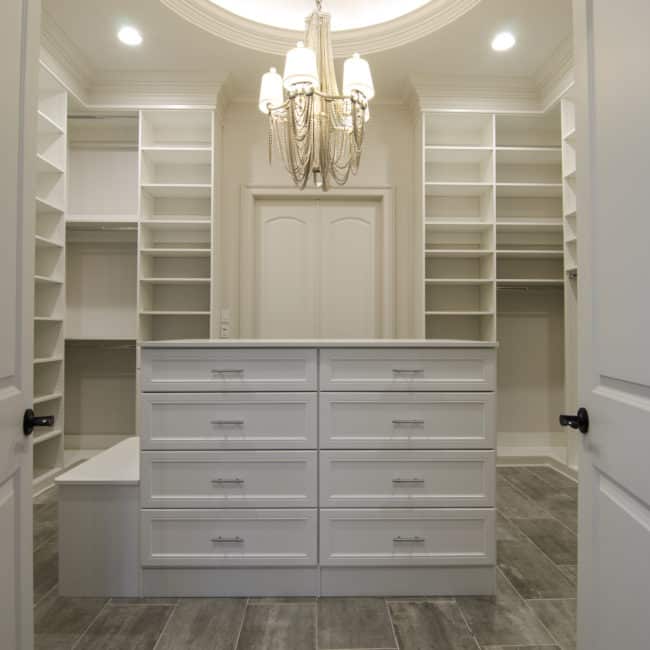 beautiful white dream closet with bright lighting